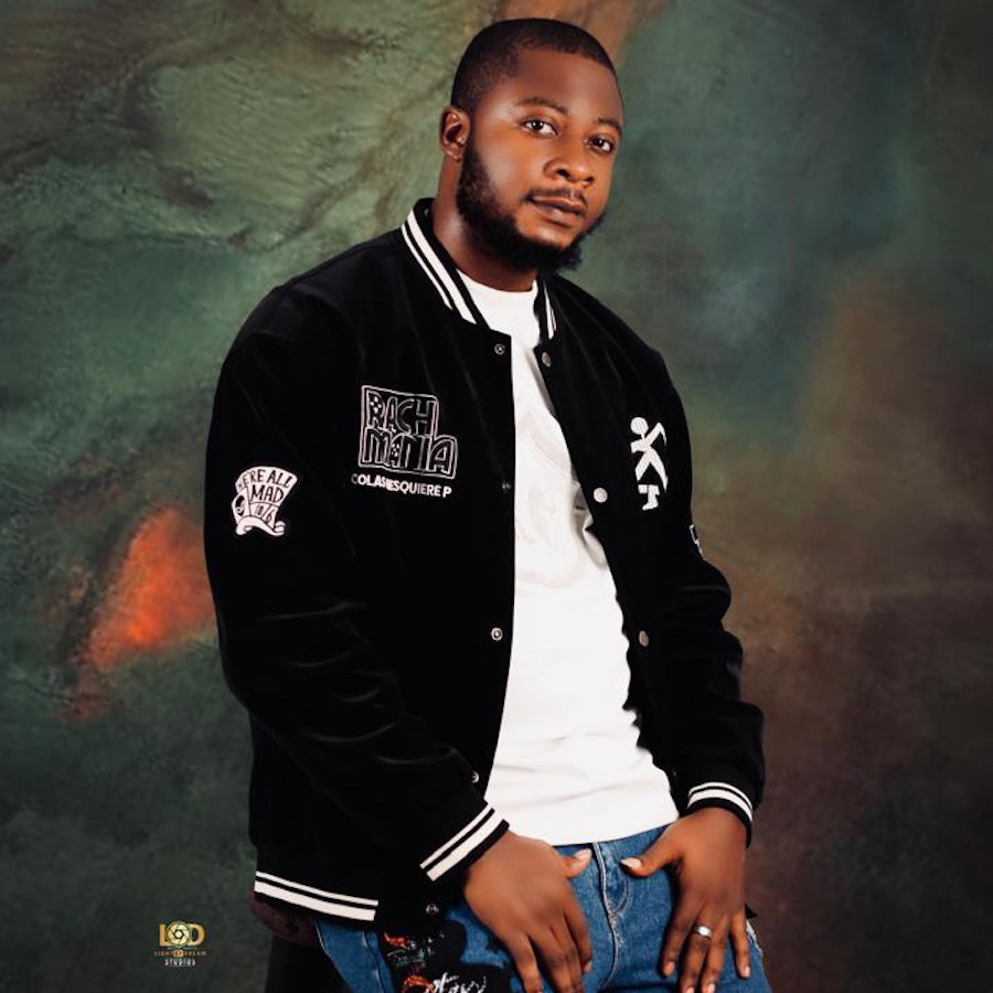 Lit bwoi in a black varsity jacket and white tee